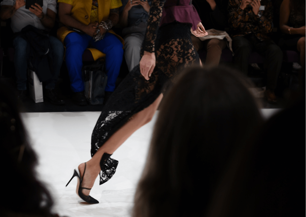 Women in Black Dress wearing high heeled shoe